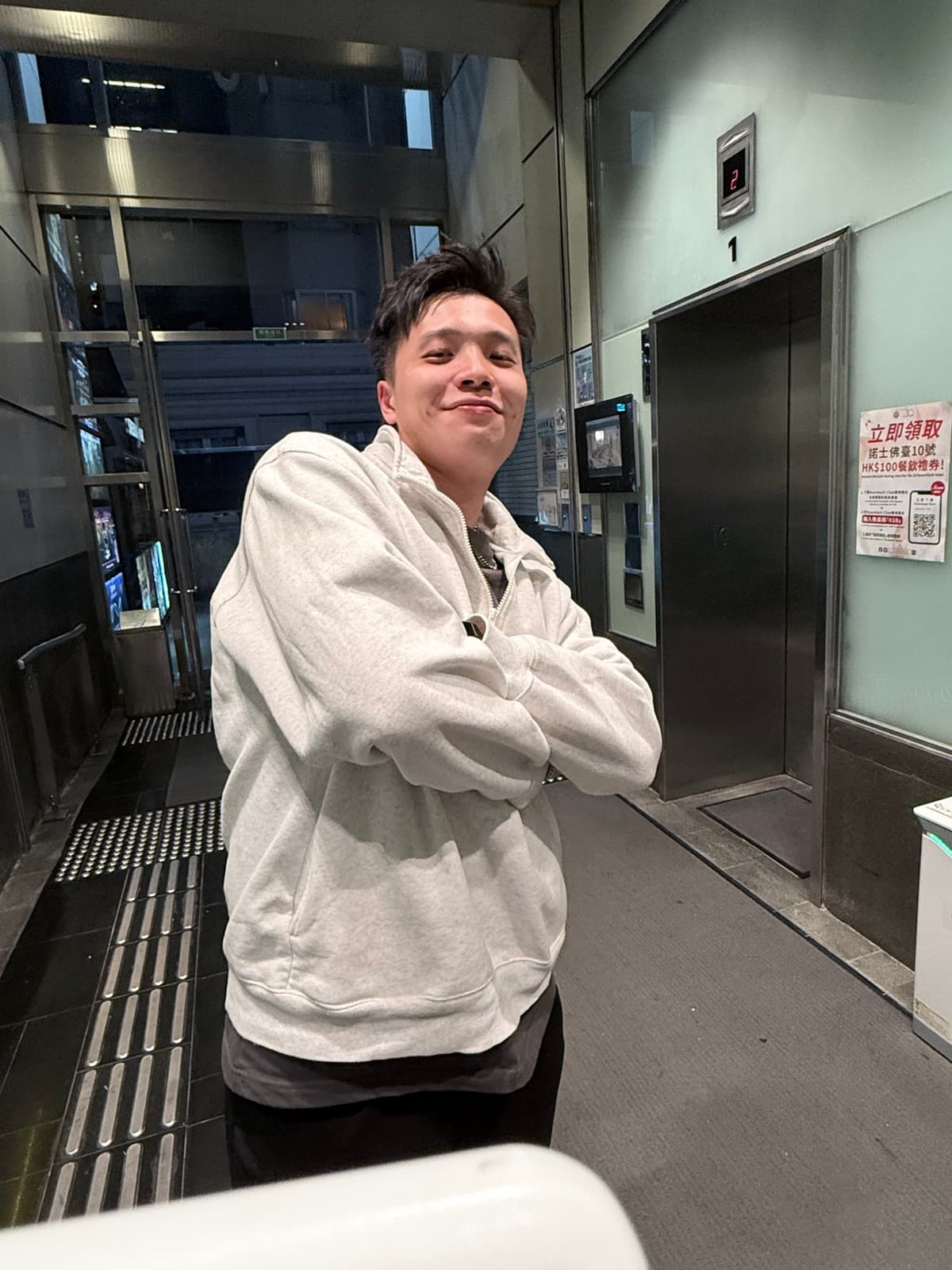 Alan Li standing in an entrance hall