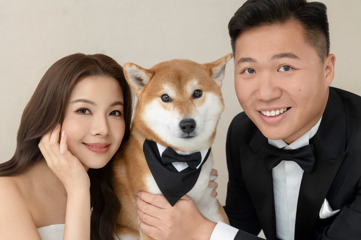 Natalie and Bryan taking a close portrait with their dog