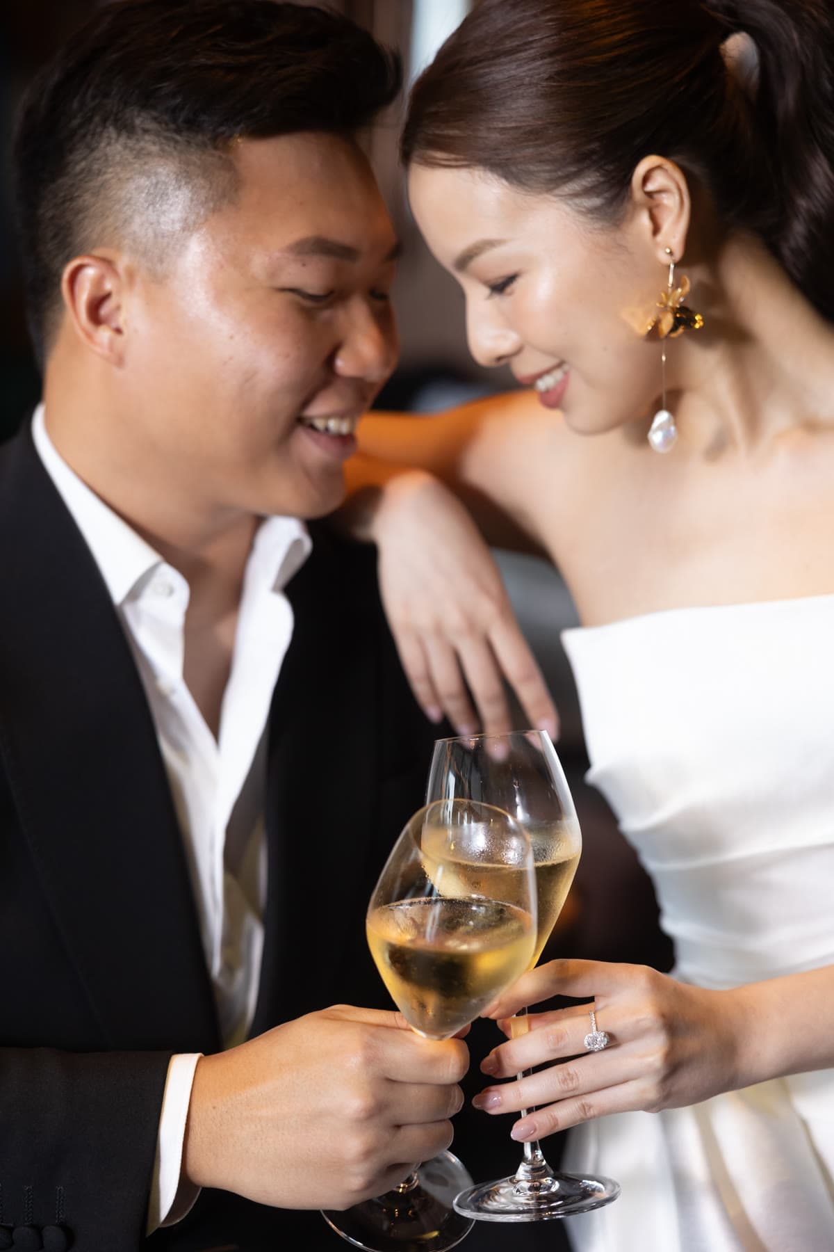 Natalie and Bryan raising glasses together