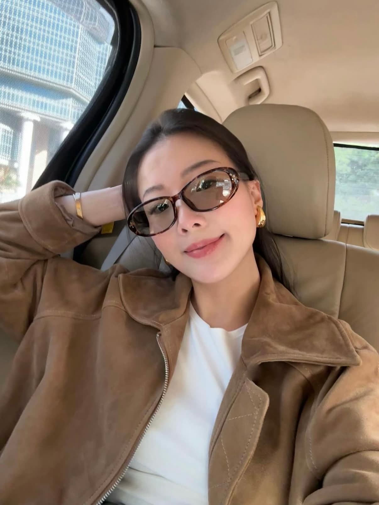 Wynnie Law sitting in a car